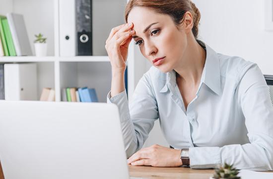 Business woman frustrated by bad print supplies